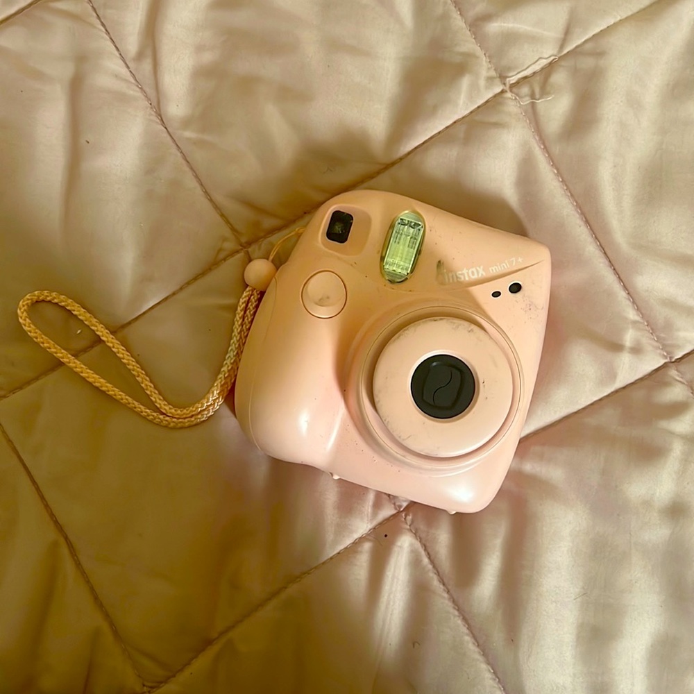 pink polaroid with film pack
